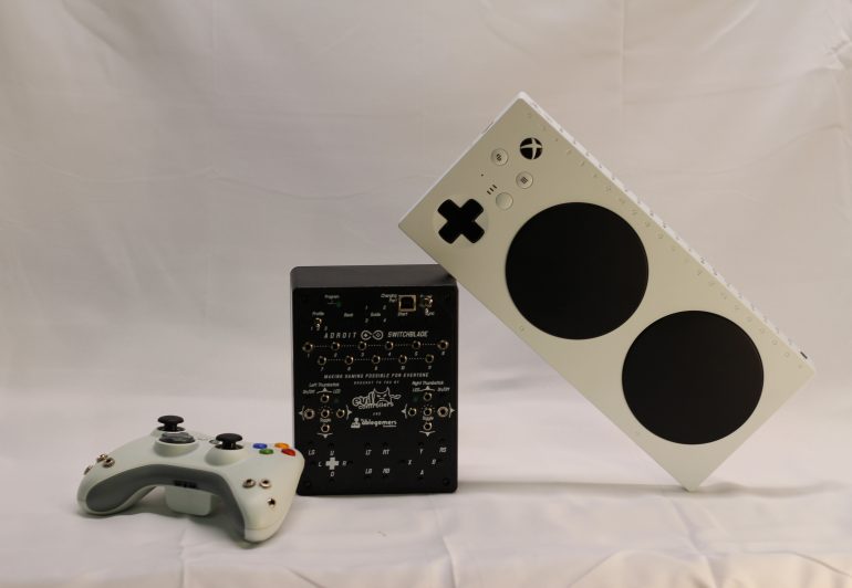 A standard controller, adroit, and Xbox adaptive controller